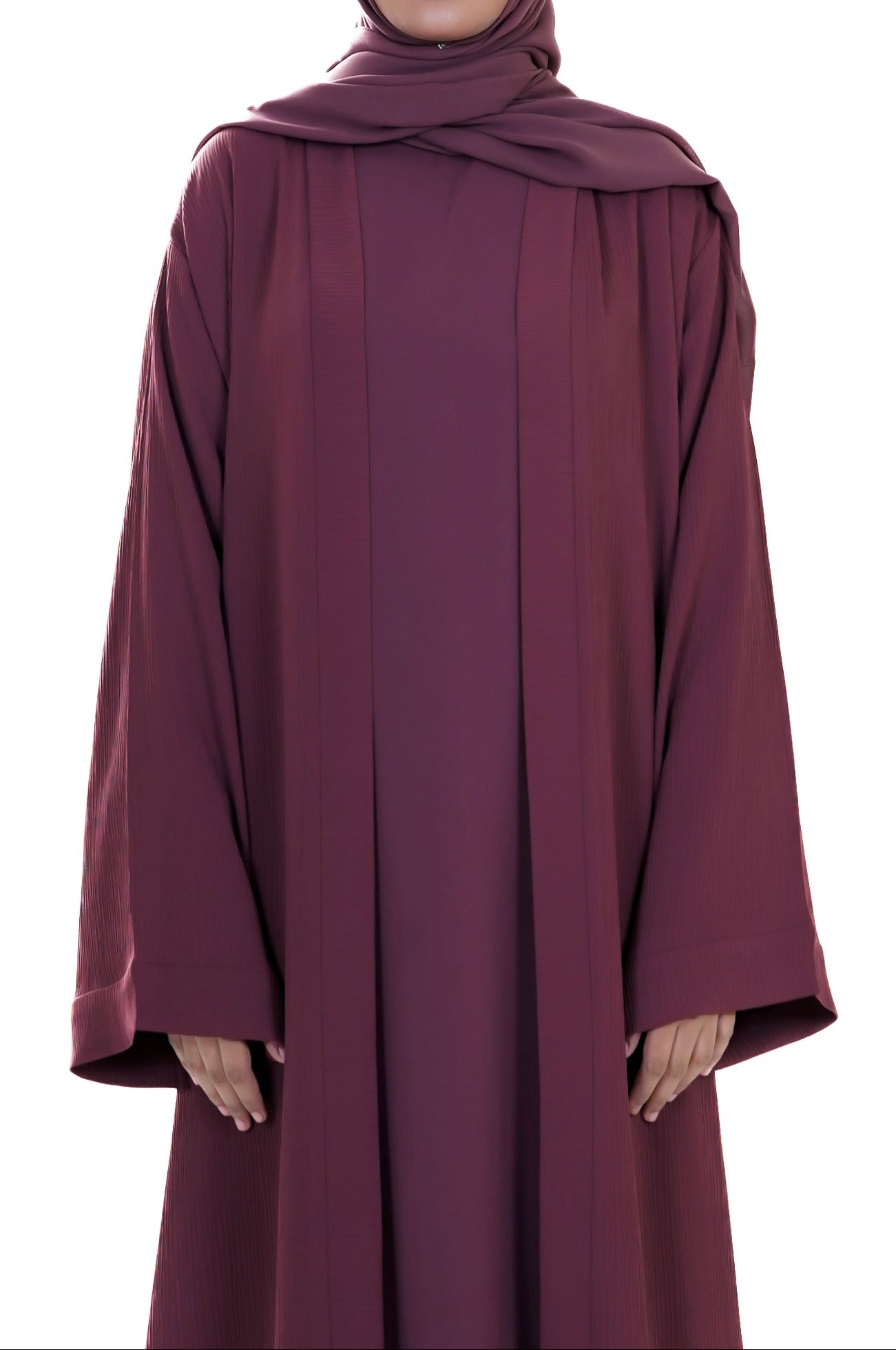 Maroon abaya worn by a model on a white background