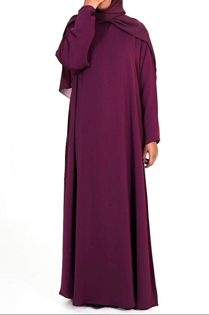 Maroon abaya with matching hijab on a white background